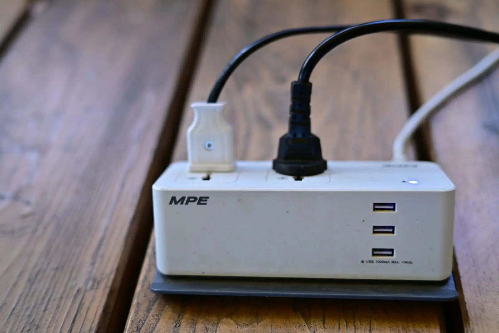 A power strip with USB sockets and plugs connected