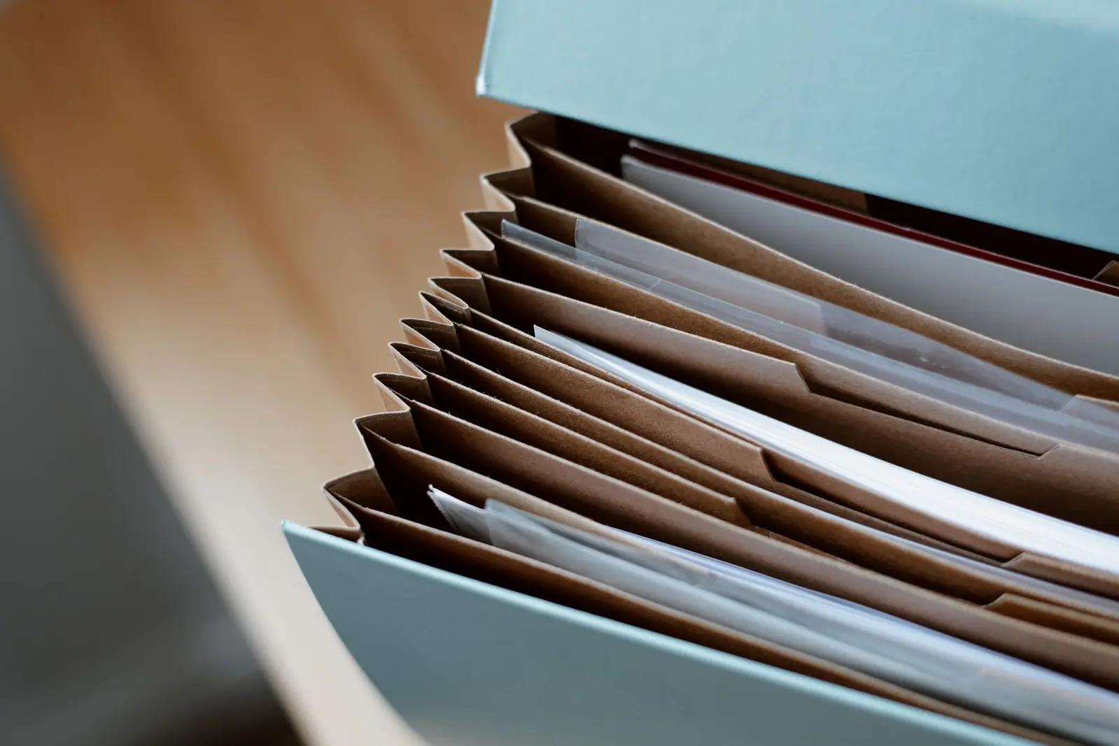 An open document case with papers arranged inside it