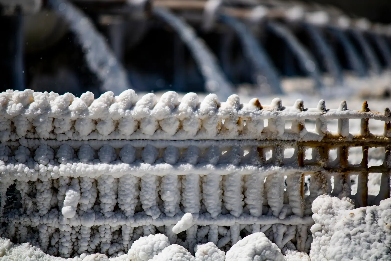 Mineral crystals built up on a metal structure