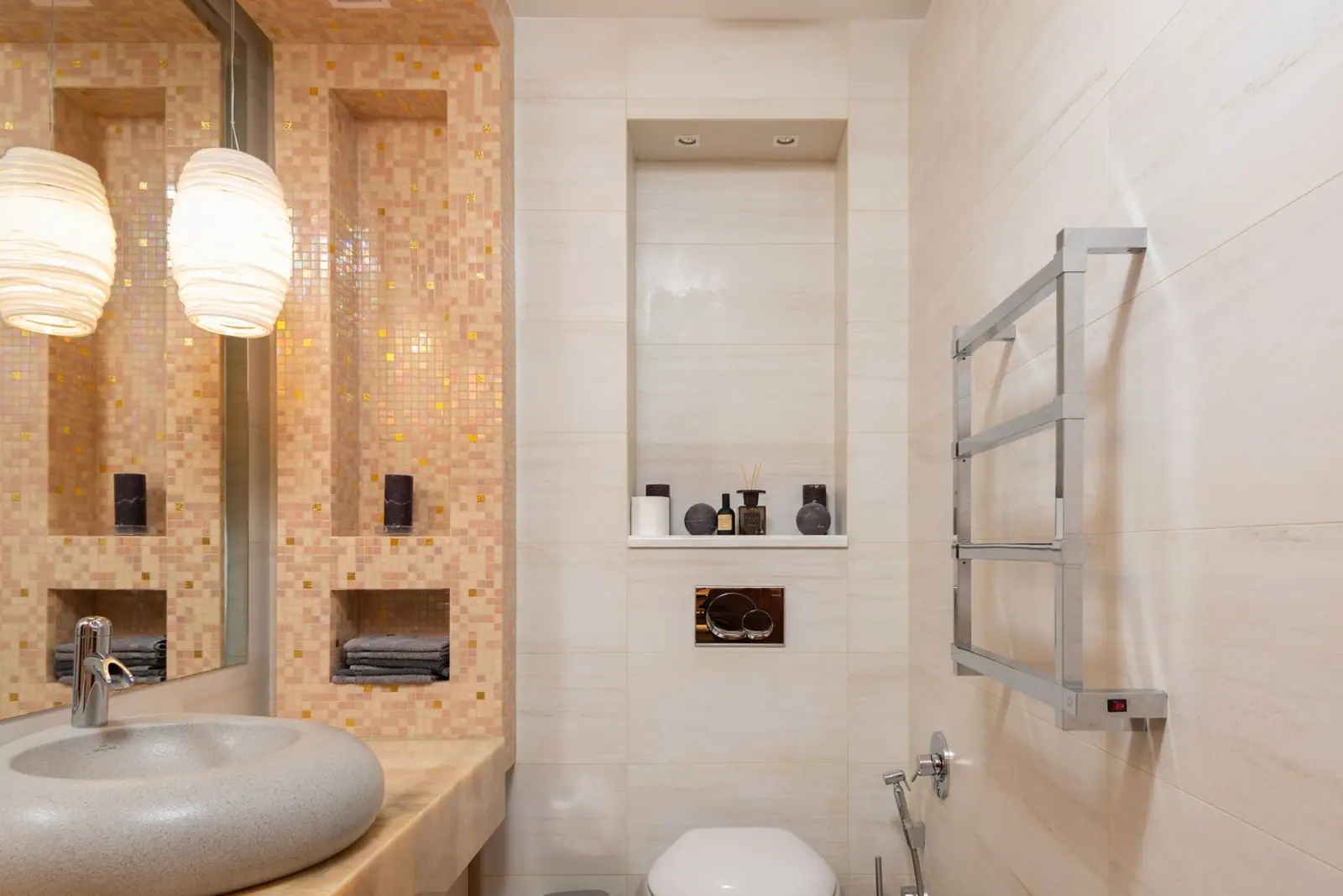 A toilet next to a wall-mounted towel rail