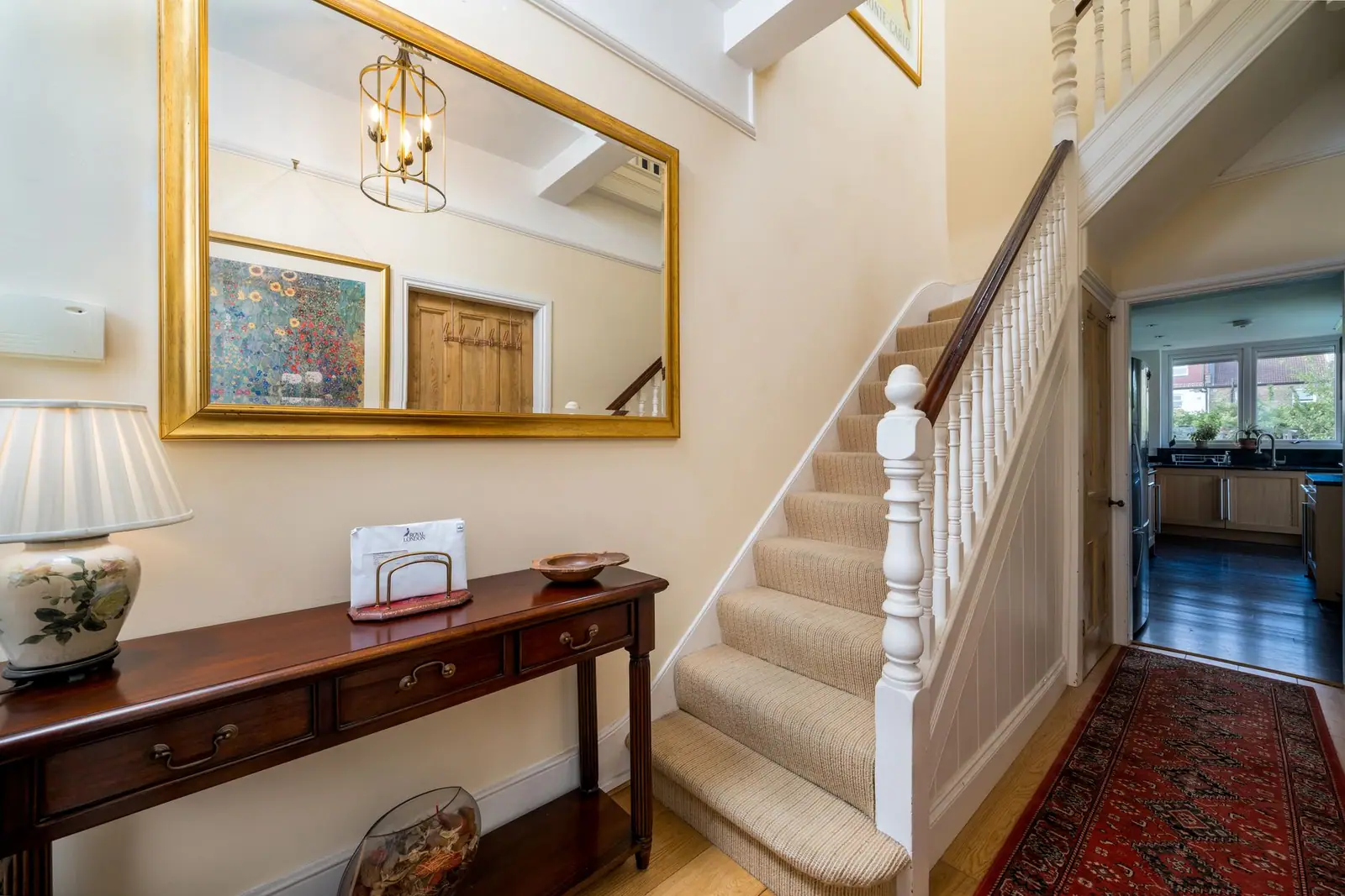 A carpeted staircase in a home hallway
